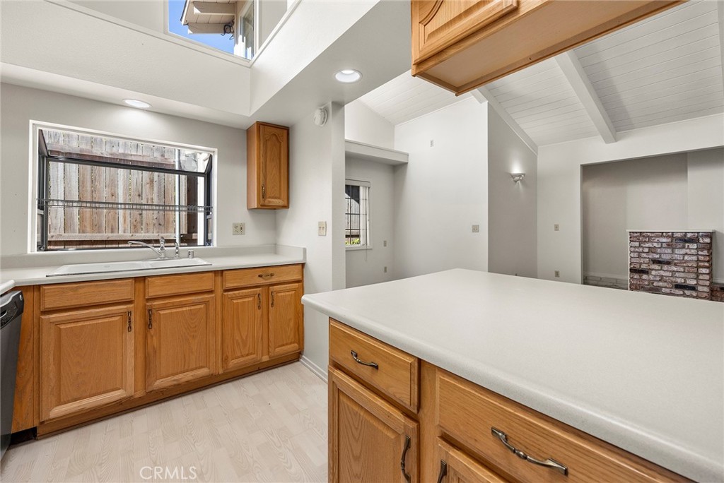 4821 Hampton Road La Canada Flintridge, CA 91011 - Photo 17 of 36 a kitchen with granite countertop cabinets stainless steel appliances a sink and a window