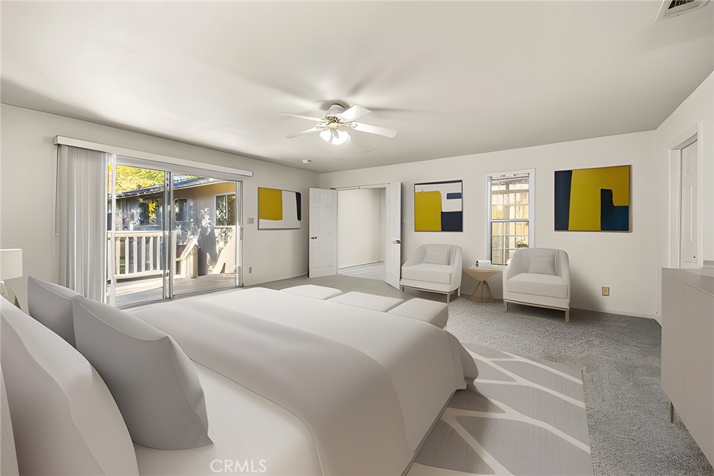 4821 Hampton Road La Canada Flintridge, CA 91011 - Photo 20 of 36 a spacious bedroom with a bed couch and a window