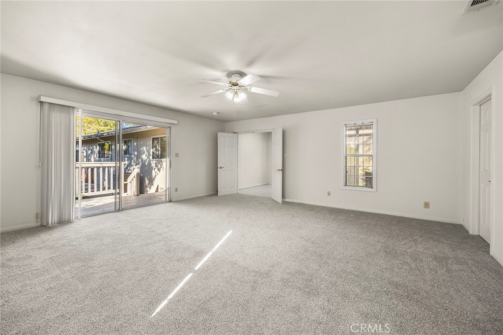 4821 Hampton Road La Canada Flintridge, CA 91011 - Photo 21 of 36 an empty room with windows and ceiling fan