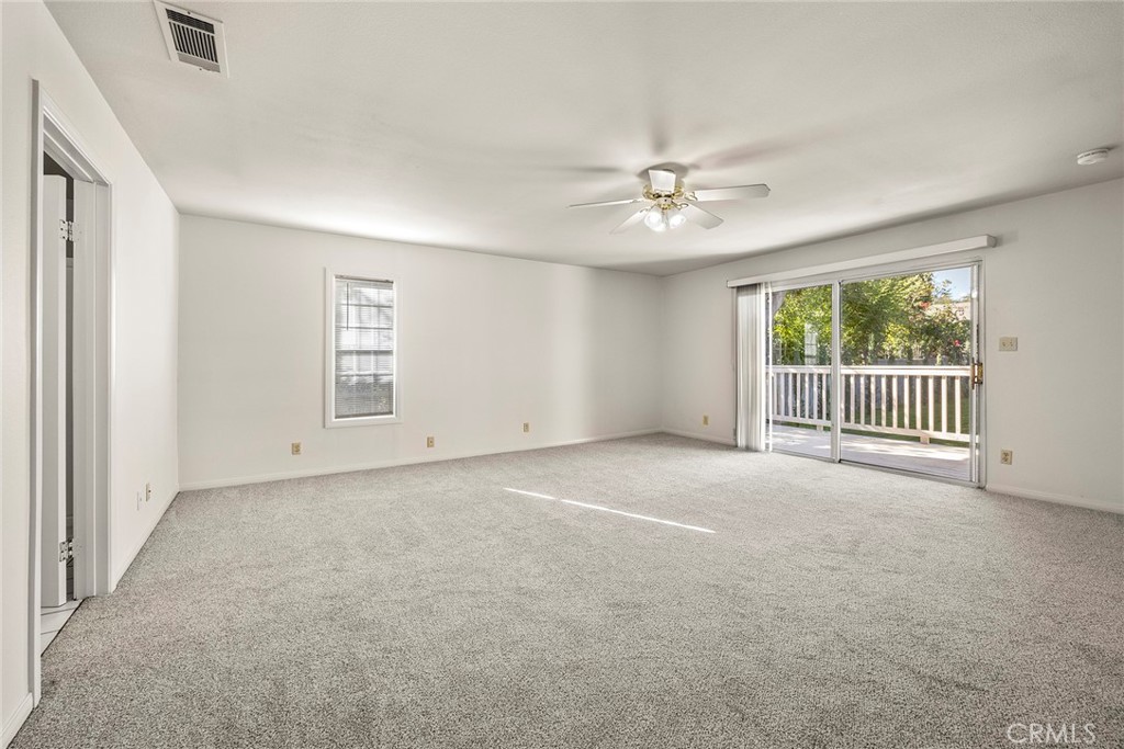 4821 Hampton Road La Canada Flintridge, CA 91011 - Photo 22 of 36 an empty room with windows and ceiling fan