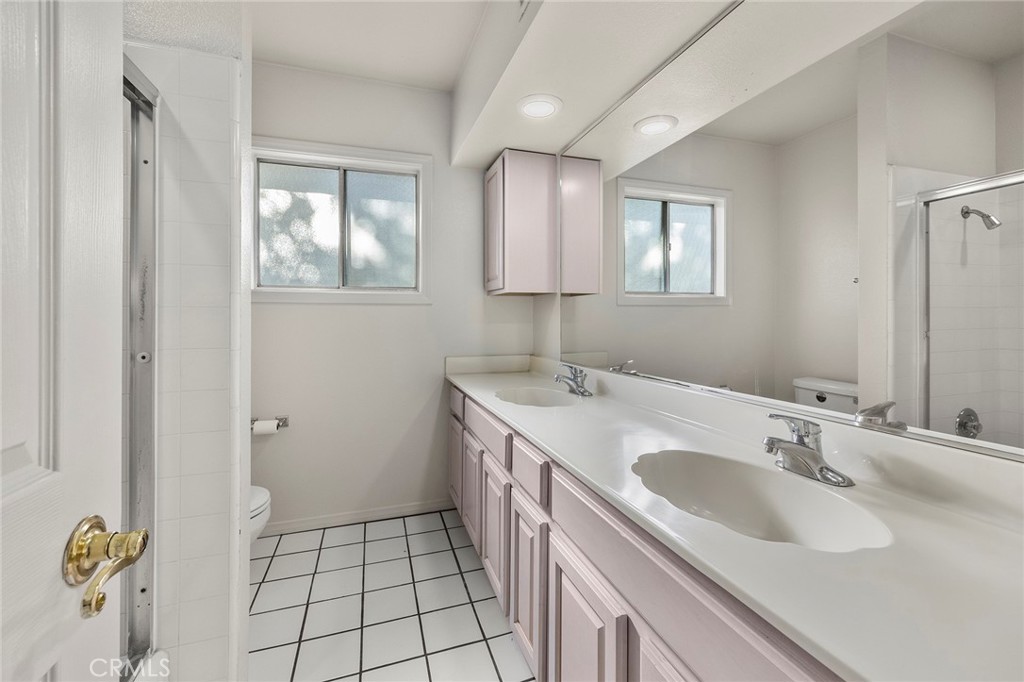 4821 Hampton Road La Canada Flintridge, CA 91011 - Photo 28 of 36 a bathroom with a sink and a mirror