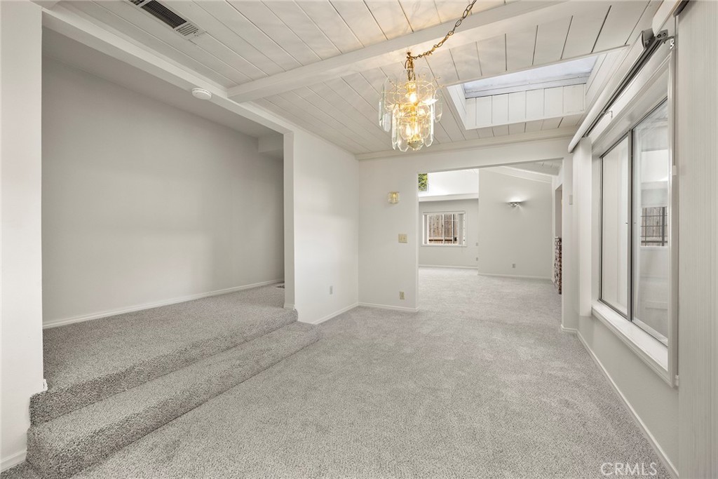 4821 Hampton Road La Canada Flintridge, CA 91011 - Photo 9 of 36 a view of a hallway with chandelier