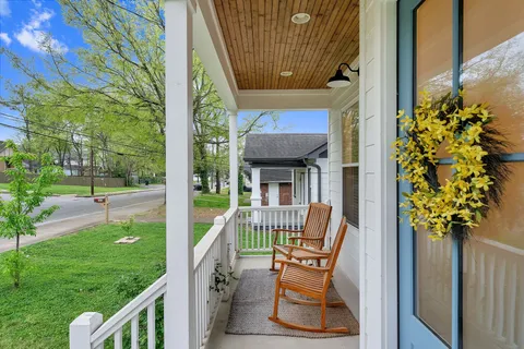 a view of deck with furniture and garden