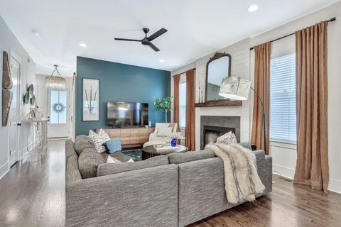 a living room with furniture and a fireplace
