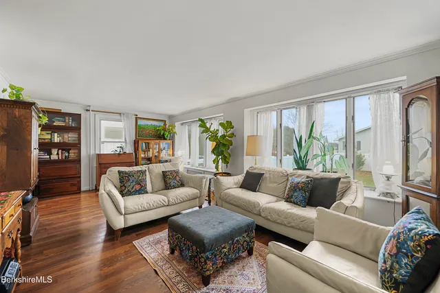 a kitchen with stainless steel appliances granite countertop wooden cabinets and a stove top oven
