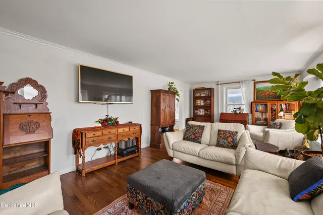 a kitchen with stainless steel appliances granite countertop lots of counter top space and wooden floor