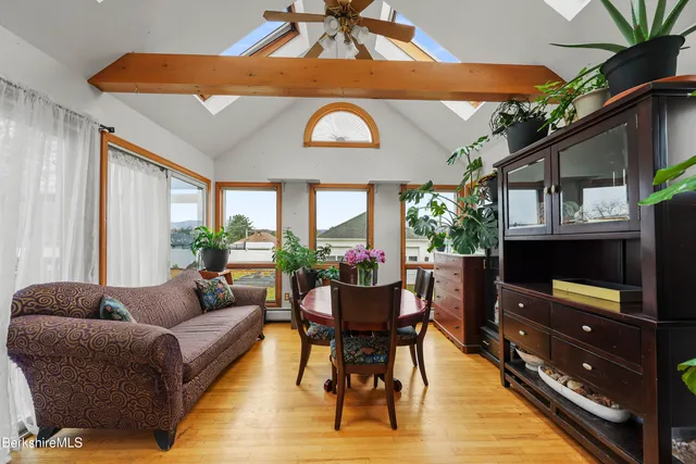 a bathroom with a toilet a sink and a mirror