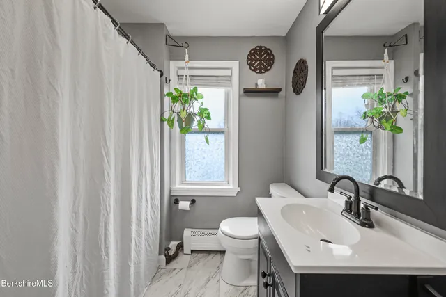 a view of a balcony with wooden floor
