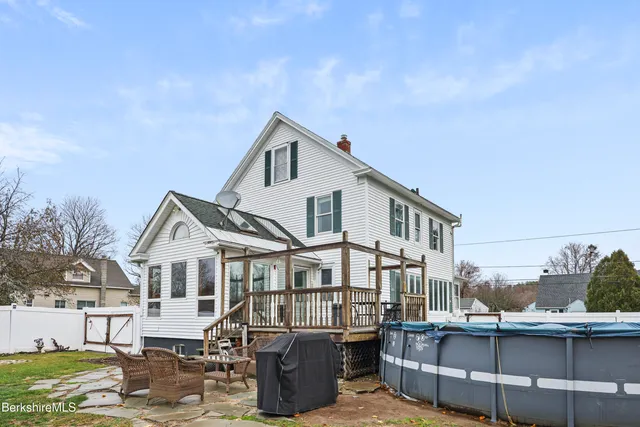 an aerial view of a house with a ocean view
