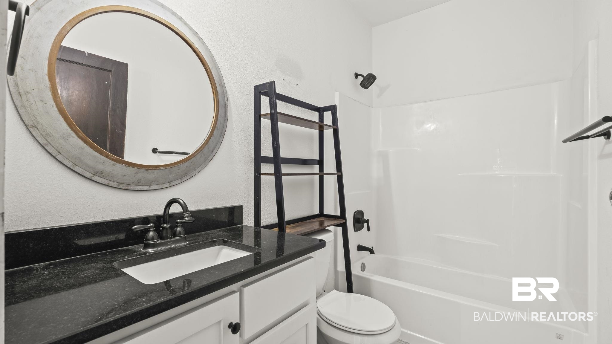 24701 Highway 98 Elberta, AL 36530 - Photo 19 of 32 Bathroom with vanity, shower / bathtub combination, and a textured wall