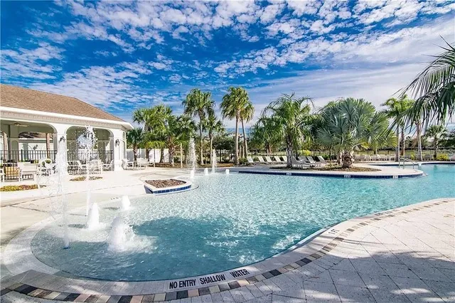 a view of swimming pool with outdoor seating