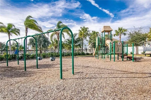 a view of a swimming pool and an outdoor seating