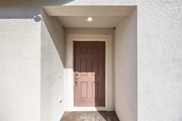 a view of a hallway with wooden floor and entryway