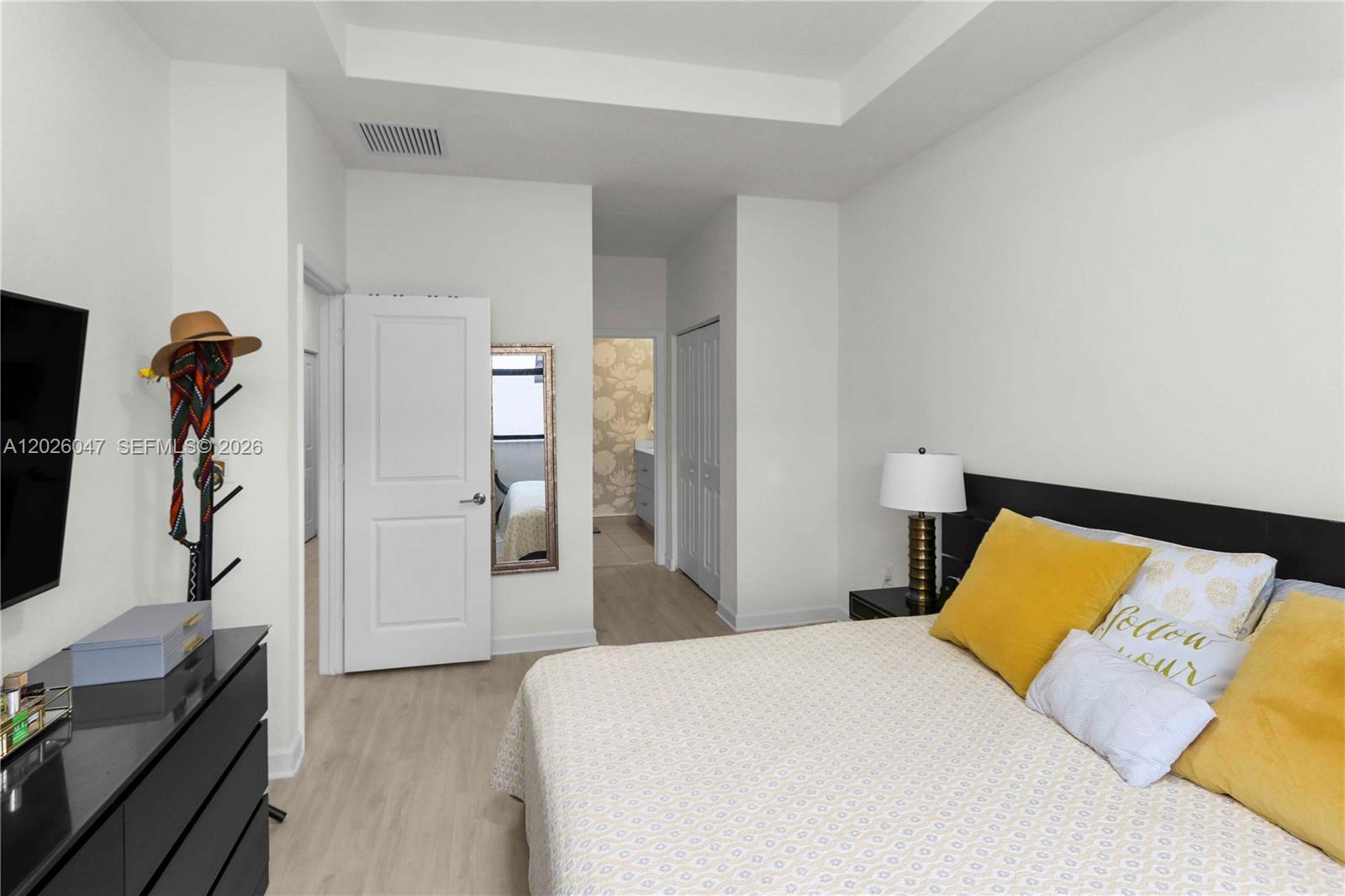 12862 Southwest 231st Street Miami, FL 33170 - Photo 21 of 30 a bedroom with a bed and a flat tv screen on dresser