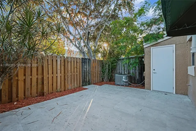a view of the wooden fence and trees