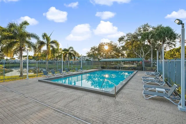 a view of swimming pool with a lounge chair