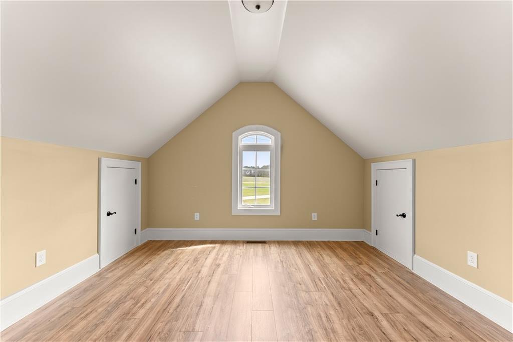 725 County Farm Road Jefferson, GA 30549 - Photo 41 of 66 an empty room with wooden floor and window