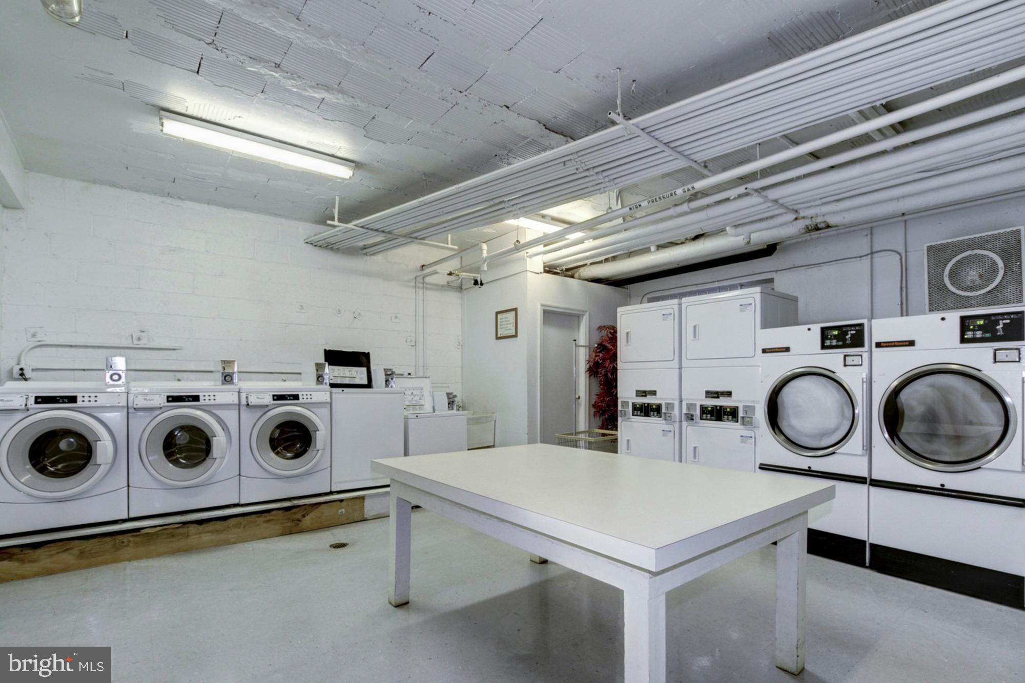 4100 W Street Northwest, Unit 416 Washington, DC 20007 - Photo 20 of 32 a utility room with dryer and washer