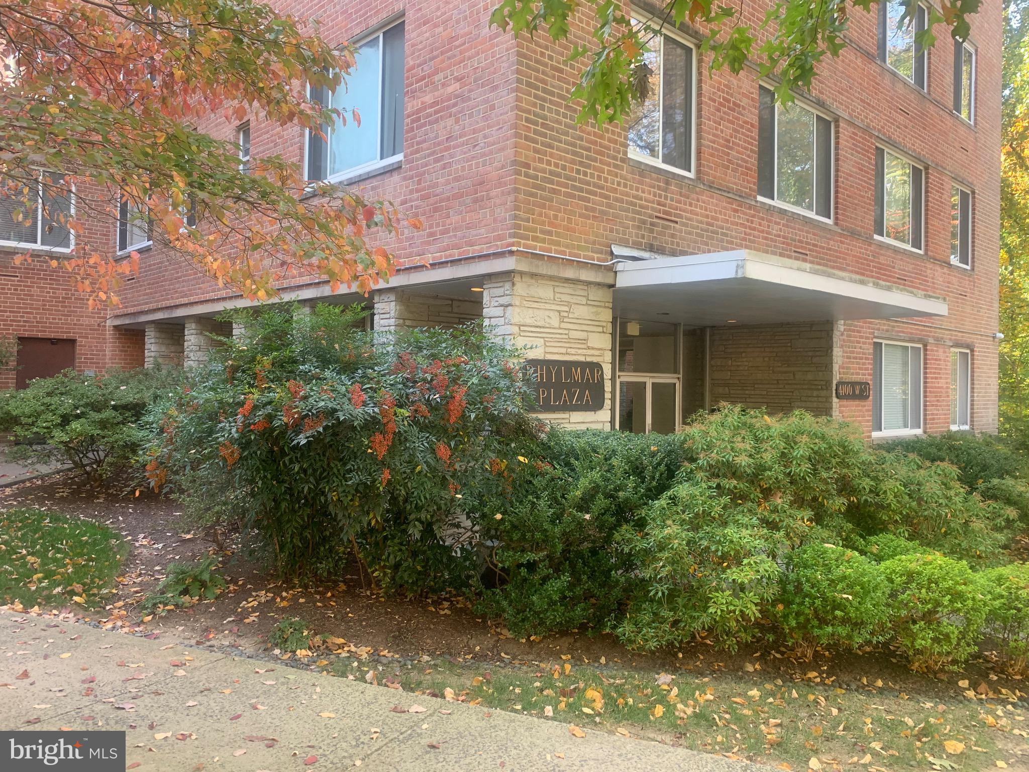 4100 W Street Northwest, Unit 416 Washington, DC 20007 - Photo 28 of 32 a view of a brick building next to a yard