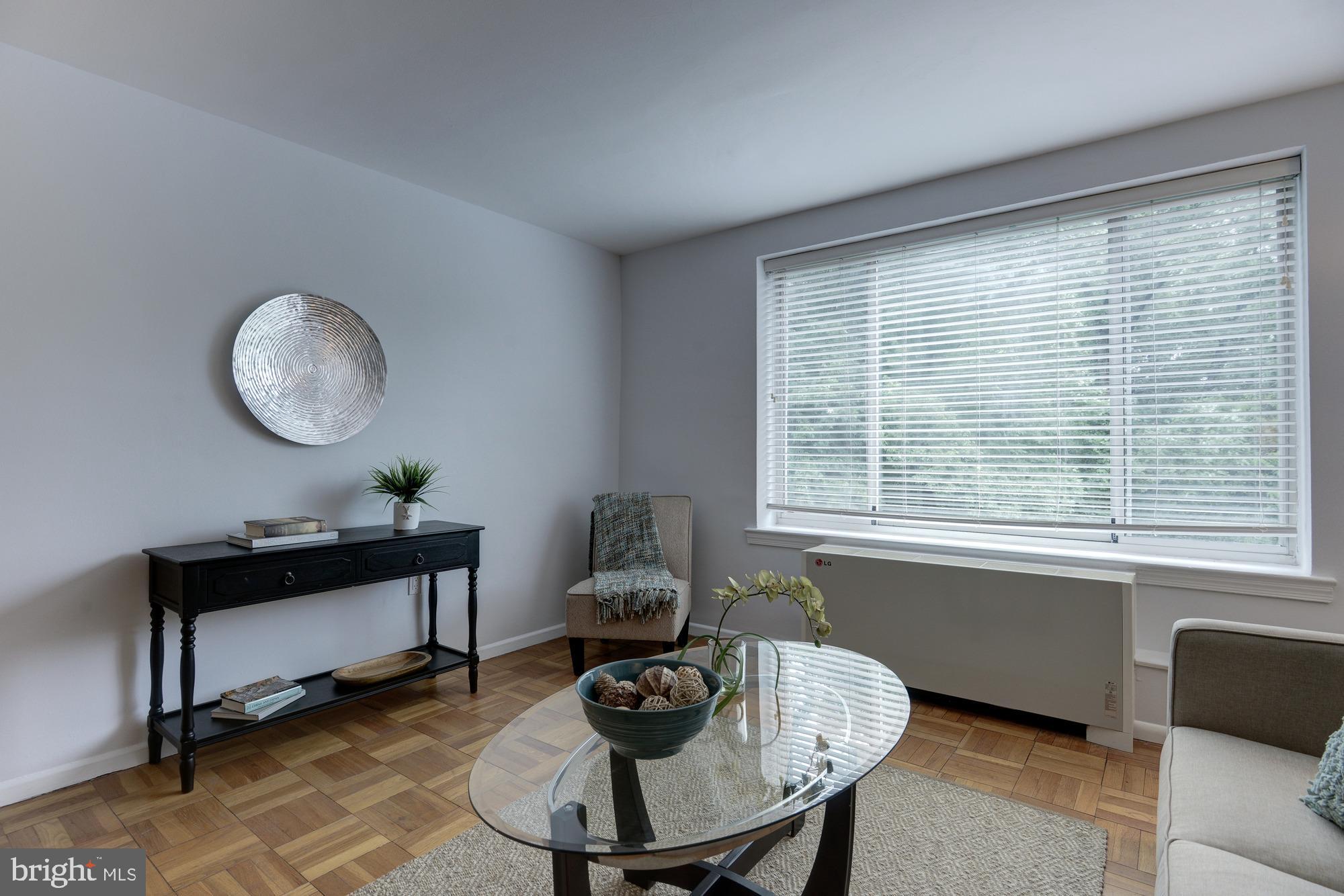 4100 W Street Northwest, Unit 416 Washington, DC 20007 - Photo 5 of 32 a living room with furniture and a window