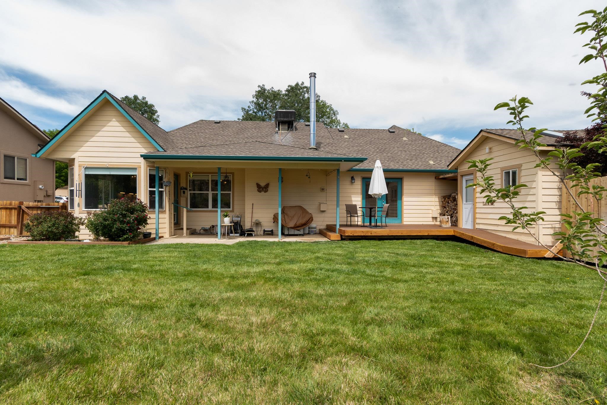 398 Butte Court Grand Junction, CO 81507 - Photo 22 of 33 a front view of a house with a garden