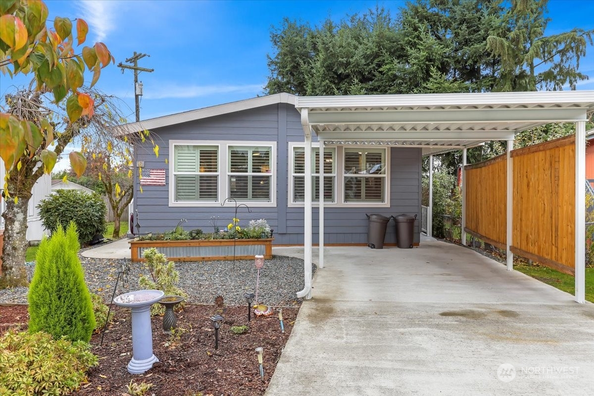 23825 15th Avenue Southeast, Unit 6 Bothell, WA 98021 - Photo 1 of 30 a view of a patio with table and chairs and potted plants