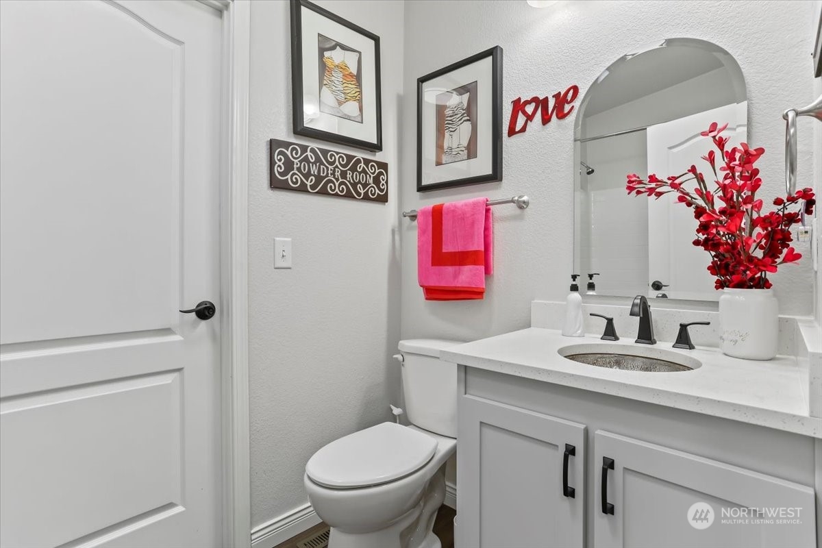 23825 15th Avenue Southeast, Unit 6 Bothell, WA 98021 - Photo 21 of 30 a bathroom with a sink mirror vanity and toilet