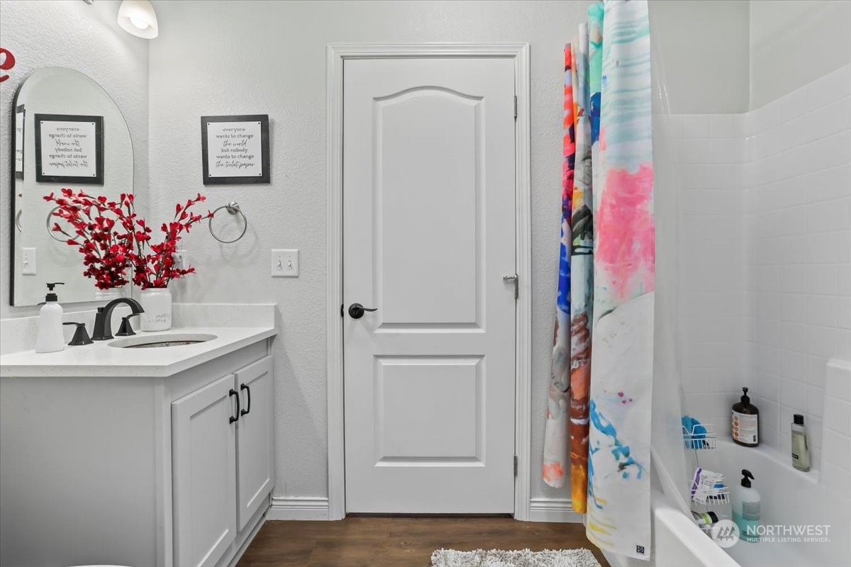 23825 15th Avenue Southeast, Unit 6 Bothell, WA 98021 - Photo 22 of 30 a bathroom with a sink vanity and a mirror
