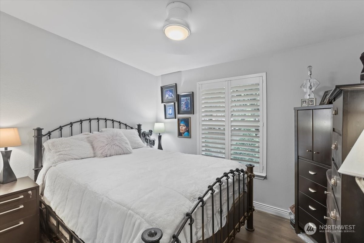 23825 15th Avenue Southeast, Unit 6 Bothell, WA 98021 - Photo 23 of 30 a bedroom with a bed and a walk in closet