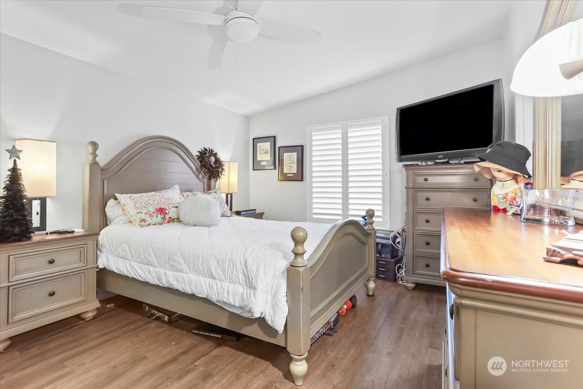 23825 15th Avenue Southeast, Unit 6 Bothell, WA 98021 - Photo 27 of 30 a bedroom with bed tv and a fireplace