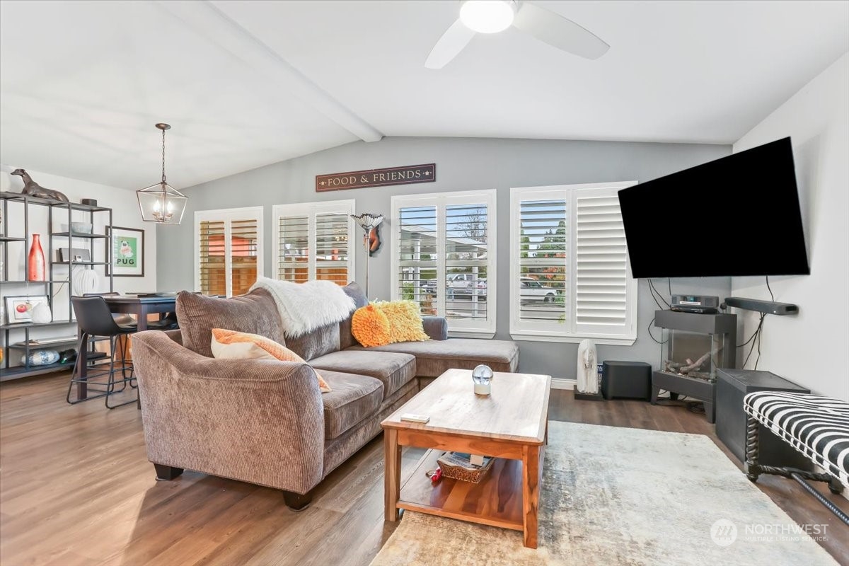 23825 15th Avenue Southeast, Unit 6 Bothell, WA 98021 - Photo 9 of 30 a living room with furniture and a flat screen tv