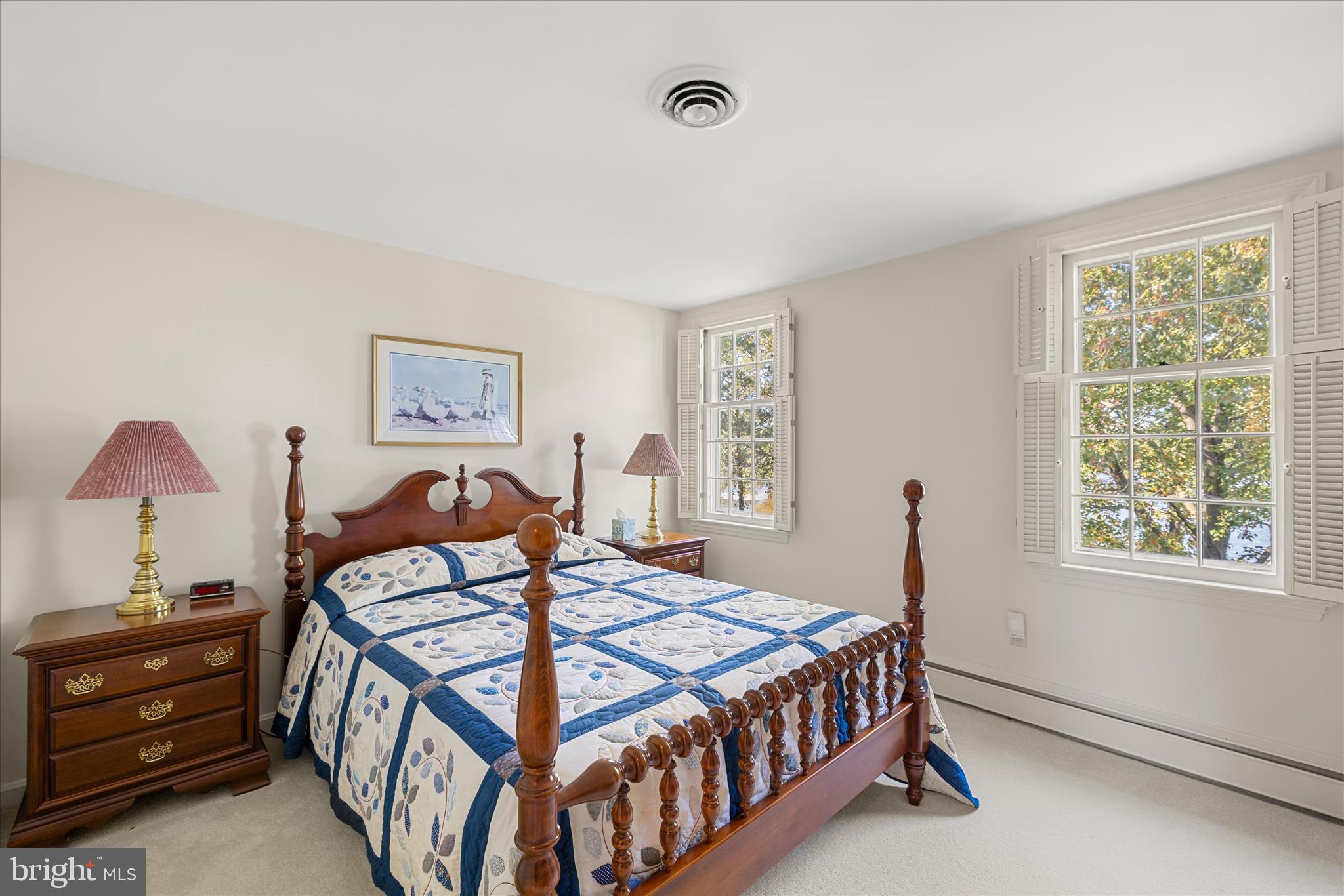 27473 Westpoint Road Easton, MD 21601 - Photo 27 of 58 a bedroom with a bed and a window