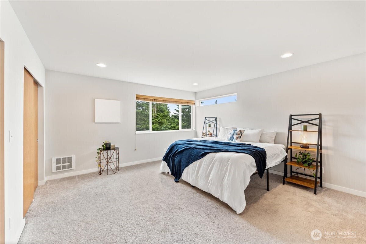12418 2nd Place Southwest Burien, WA 98146 - Photo 12 of 39 a bedroom with a bed and a window