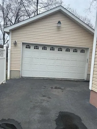 a front view of a house with garage