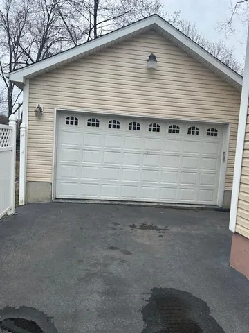 a front view of a house with garage