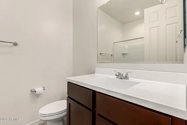a bath tub sitting next to a white sink and vanity