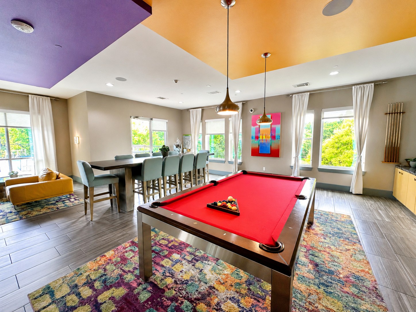 1900 Barton Springs Road, Unit 3036 Austin, TX 78704 - Photo 13 of 19 Bright windows illuminate this versatile recreation room, complete with a pool table and a high-top dining area.