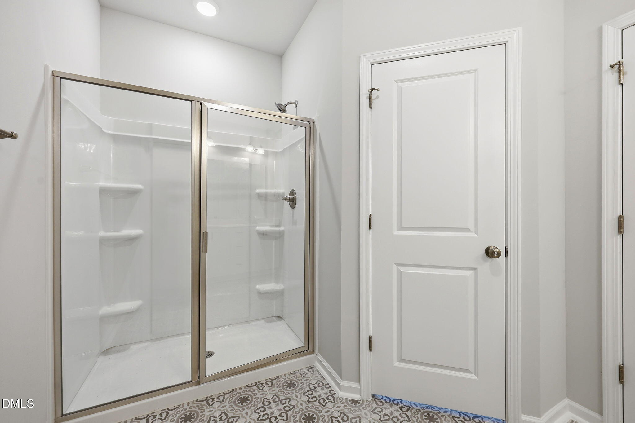 191 Nectar Lane Bunnlevel, NC 28323 - Photo 26 of 35 a bathroom with a glass shower door