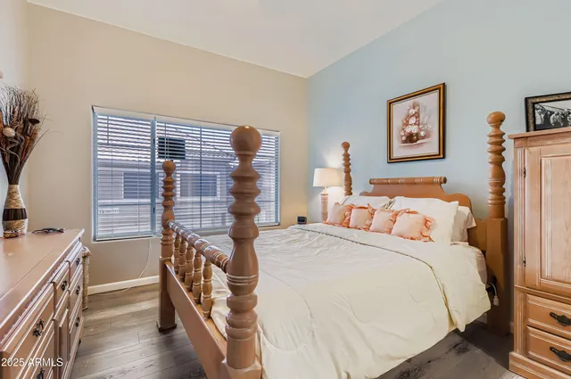 a bed room with a bed and a chair