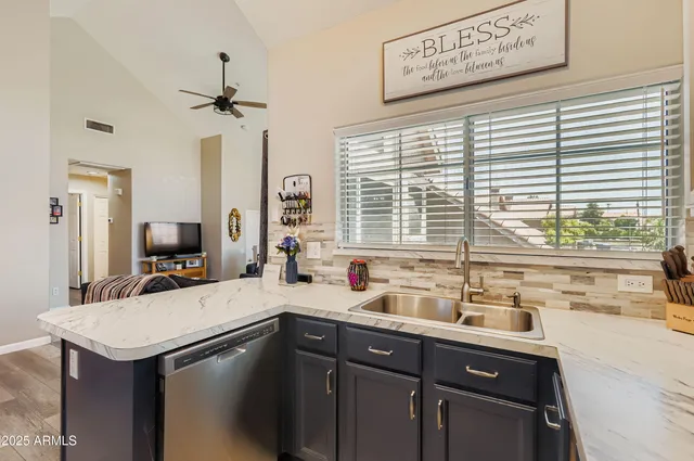 a kitchen with a sink and a window