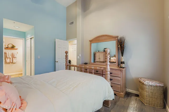 a bedroom with a bed and a table