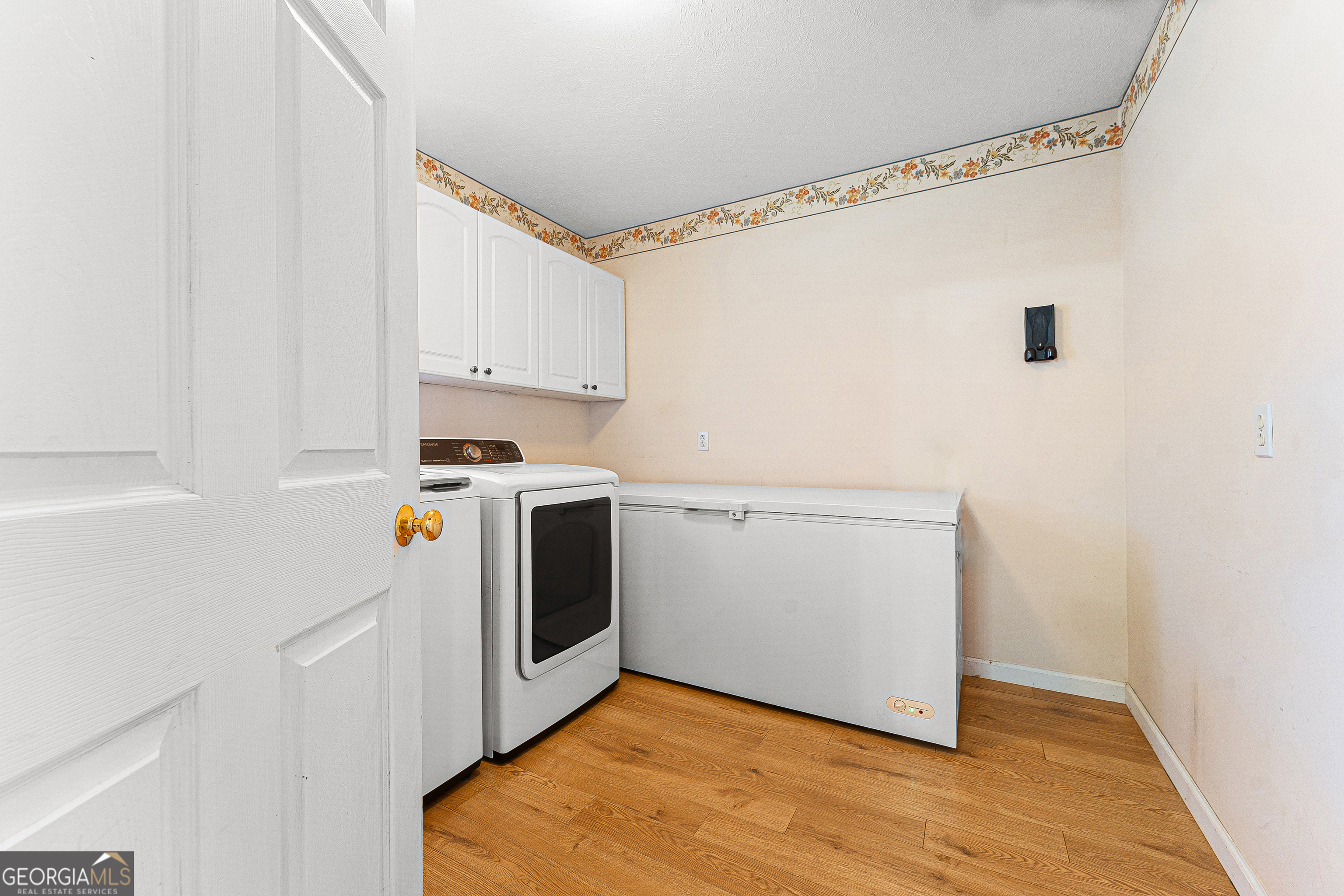 281 Cherokee Drive Fair Play, SC 29643 - Photo 21 of 29 a utility room with wooden floor washer and dryer
