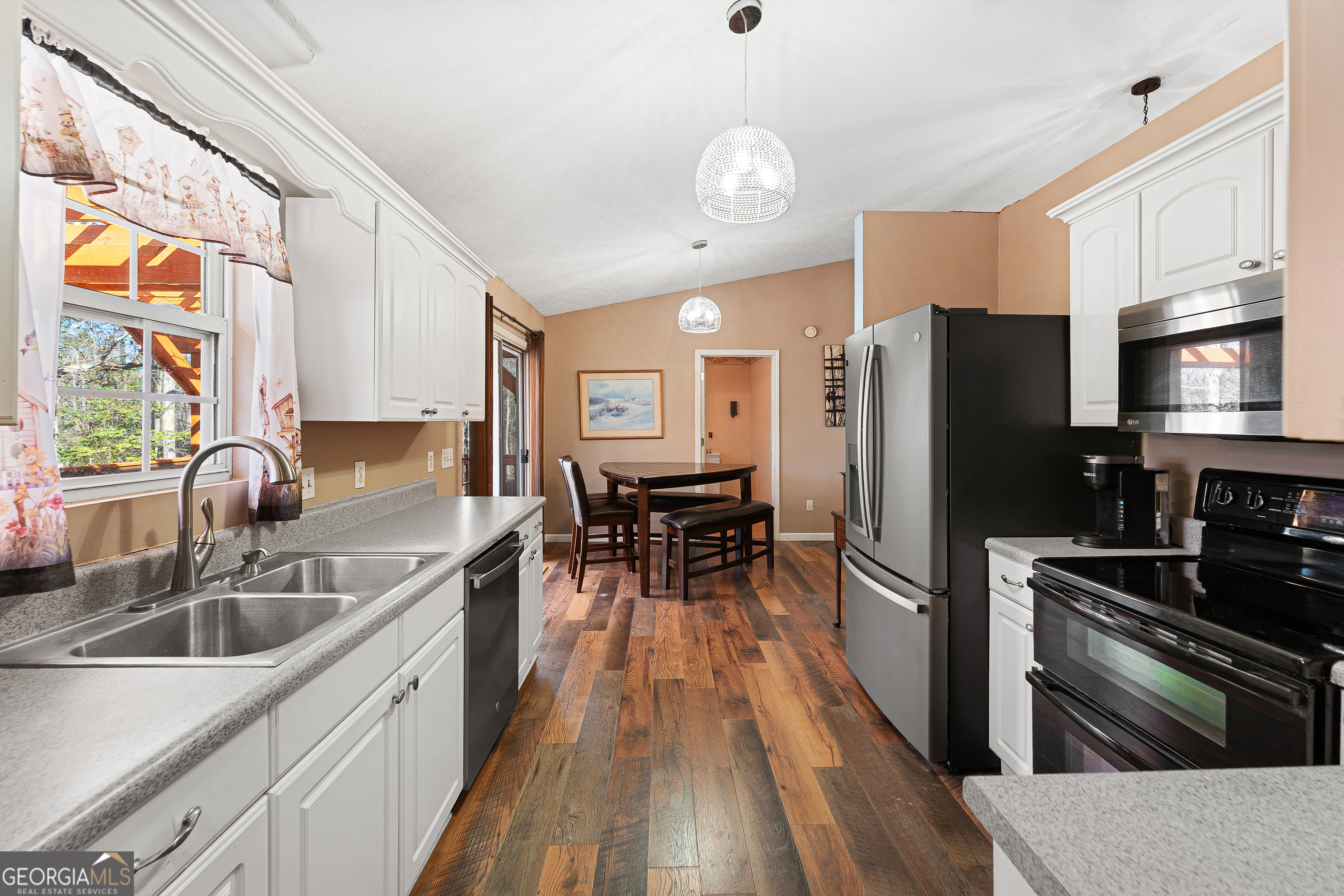 281 Cherokee Drive Fair Play, SC 29643 - Photo 10 of 29 a kitchen with granite countertop a sink stove and refrigerator