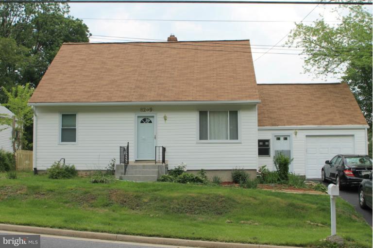 8209 Oakleigh Road Baltimore, MD 21234 - Photo 1 of 27 a front view of a house with a garden