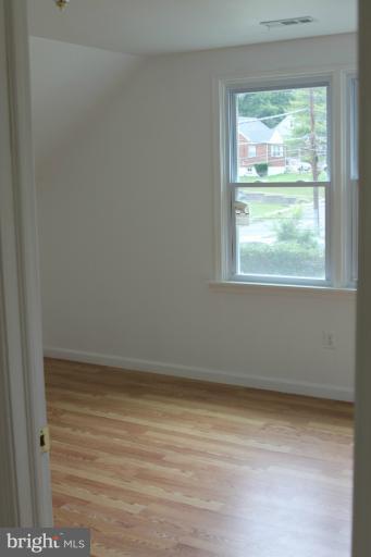 8209 Oakleigh Road Baltimore, MD 21234 - Photo 12 of 27 a view of an empty room with a window