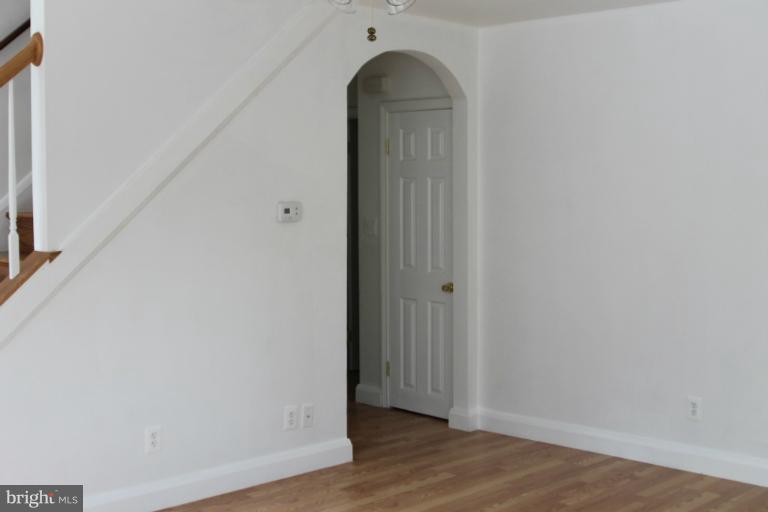 8209 Oakleigh Road Baltimore, MD 21234 - Photo 17 of 27 a view of a room with wooden floor