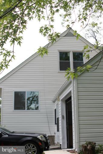 8209 Oakleigh Road Baltimore, MD 21234 - Photo 23 of 27 a front view of a house with a garage