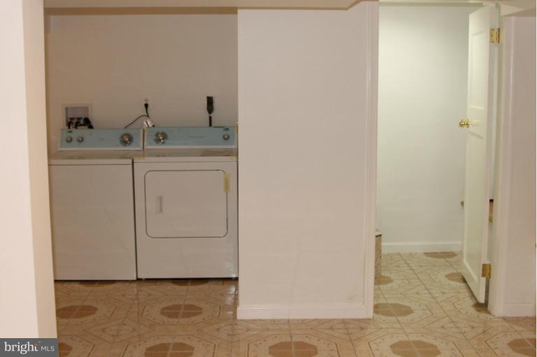 8209 Oakleigh Road Baltimore, MD 21234 - Photo 4 of 27 a bathroom with a sink and a mirror