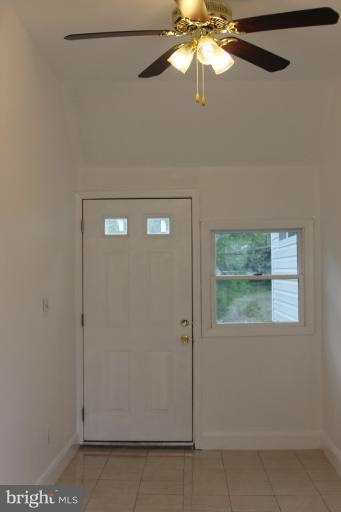 8209 Oakleigh Road Baltimore, MD 21234 - Photo 6 of 27 a view of a livingroom with a fan and a window
