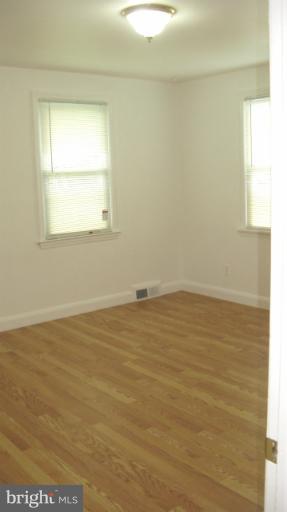 8209 Oakleigh Road Baltimore, MD 21234 - Photo 10 of 27 a view of an empty room with a window